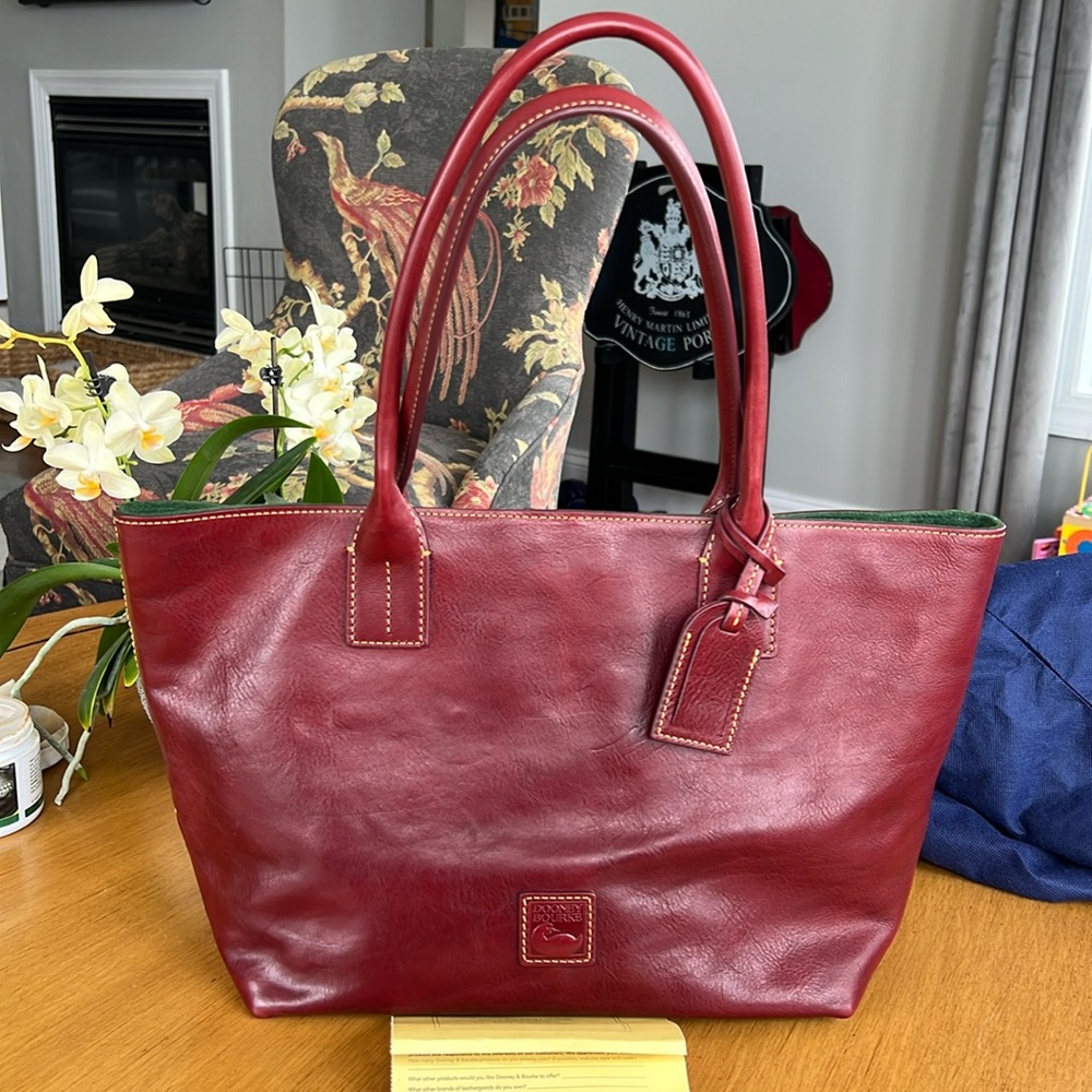 Dooney & Bourke small Russell Bordeaux. Gently used with tags and dust bag.